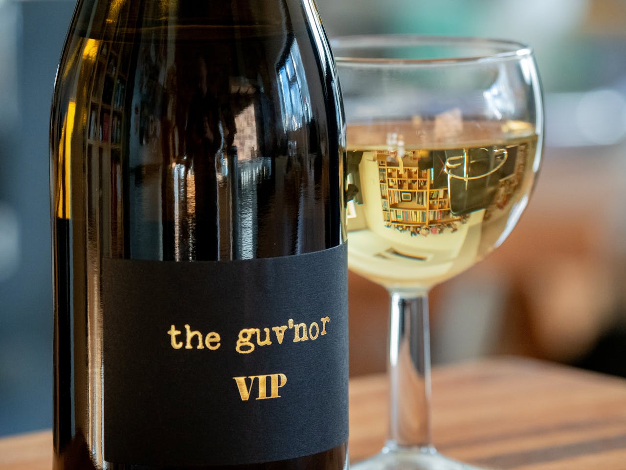 Sophisticated presentation of wine bottle and glass, perfect for a luxurious setting.